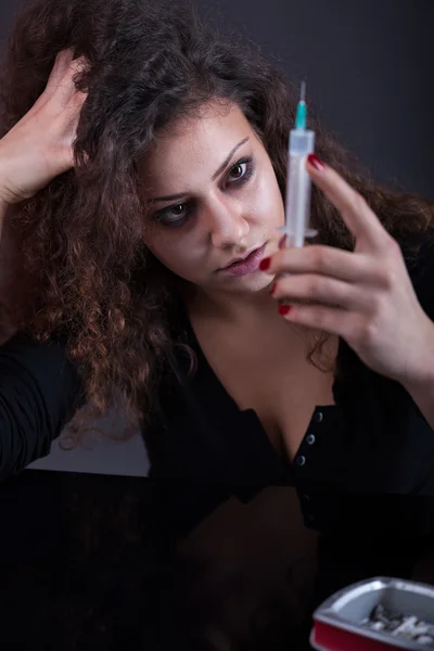 Young woman with drug addiction on dark background — Stock Photo, Image