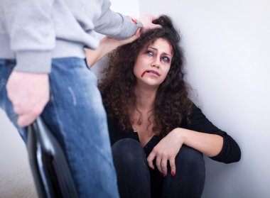  Despaired woman beaten by drunk man. concept of home violence