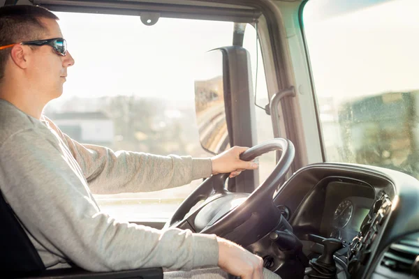 Truck driver in the cab — Stock Photo, Image
