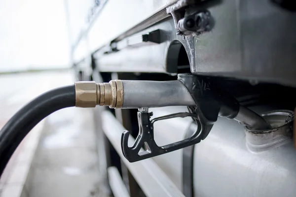 Gray fuel nozzle in pouring to car — Stock Photo, Image