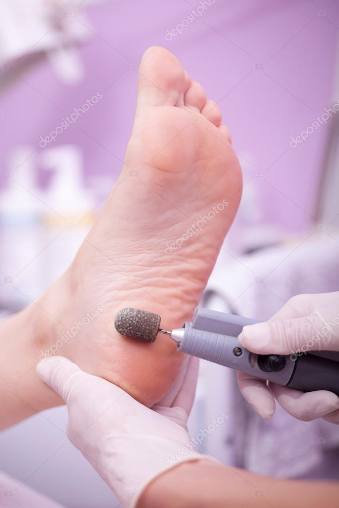 Foot care treatment ,woman at the beautician for pedicure 