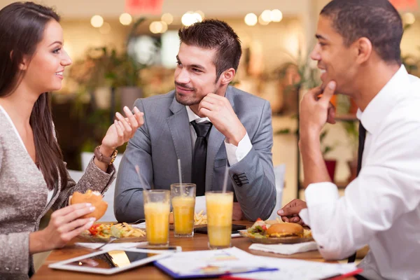 Business people enjoy in lunch at restaurant Stock Image