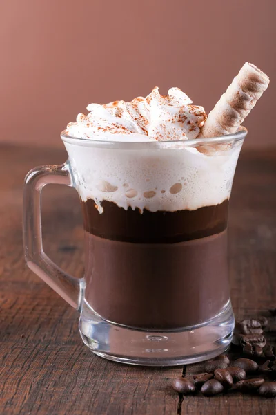 Hot chocolate on wooden background — Stock Photo, Image