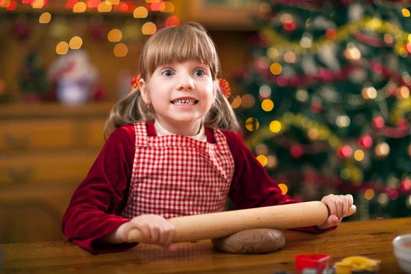 Funny young girl preparing cookies in Xmas — Stock Photo, Image