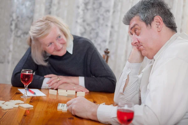 Senior people in retirement home playing domino game — Stock Photo, Image