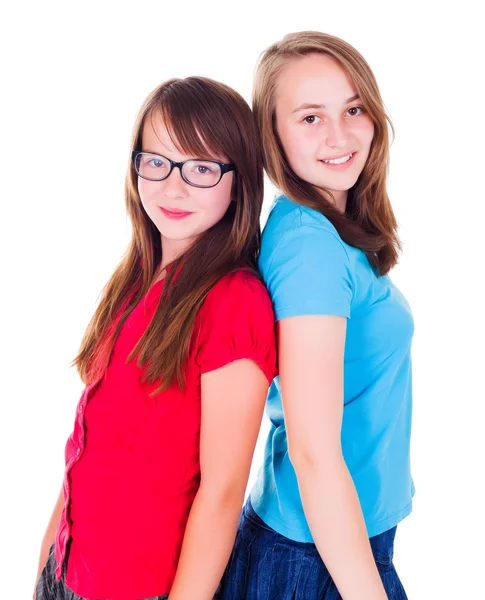 Retrato de dos chicas adolescentes de pie espalda con espalda —  Fotos de Stock