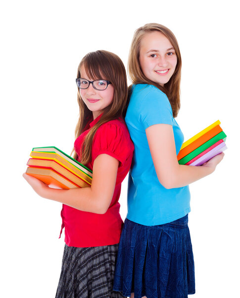 Счастливые школьницы с красочными книгами
