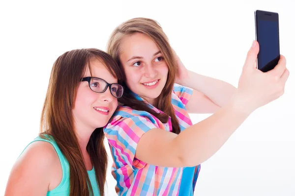 Girlfriends taking selfie with phone Stock Picture