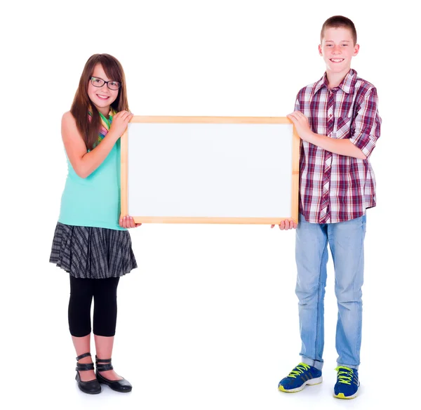 Boy and girl holding an empty advertising board — Stock Photo, Image