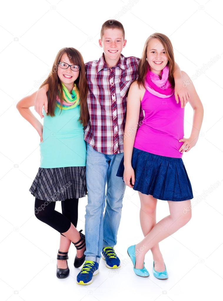 Teen boy standing with two girlfriends