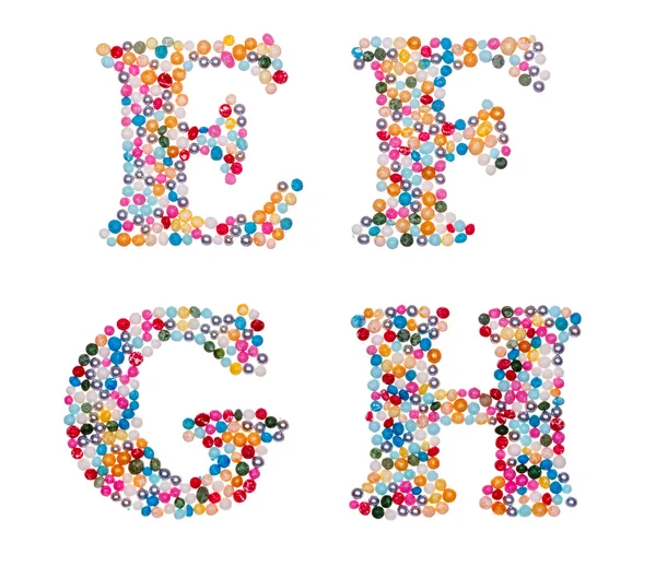 Großbuchstaben aus bunten Streuseln — Stockfoto