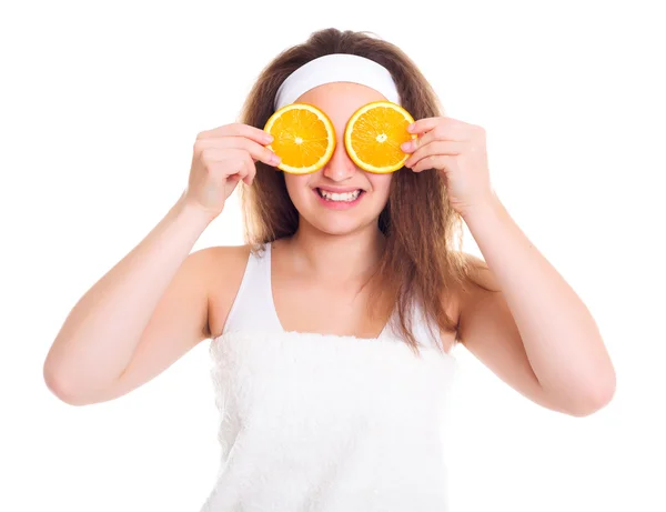 Girl with orange slices over her eyes — Stock Photo, Image
