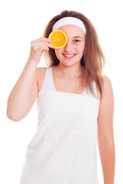 Girl with orange slice over her eye — Stock Photo, Image