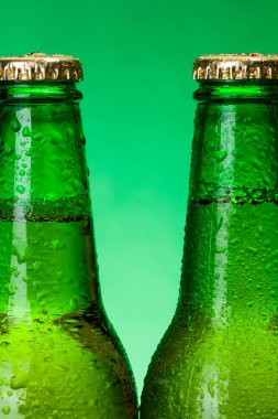 Macro of wet green beer bottles clipart