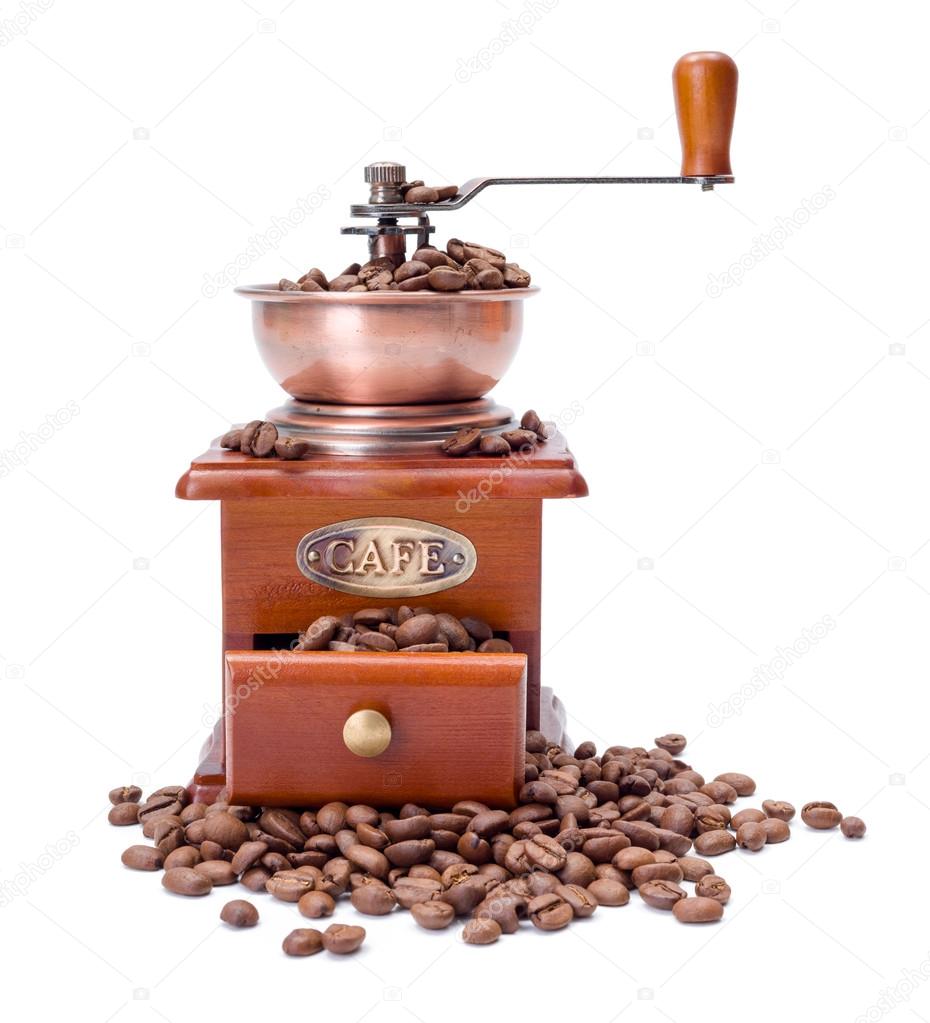 Old fashioned coffee ginder with beans