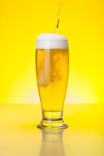 Beer being pured into glass — Stock Photo, Image