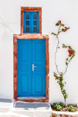 Greek house door in Santorini clipart
