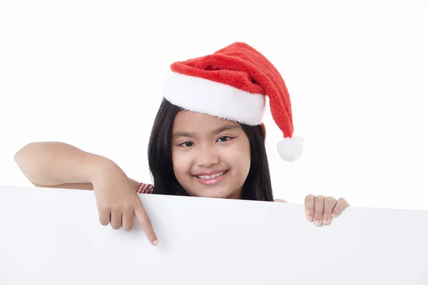 Portrait Une Petite Fille Heureuse Portant Chapeau Père Noël Pointant — Photo