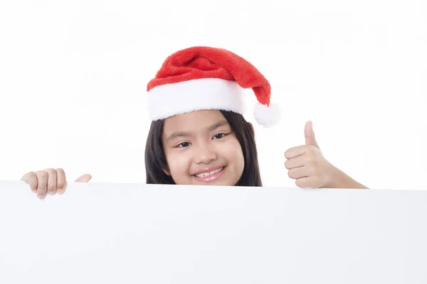 Portrait Une Petite Fille Heureuse Portant Chapeau Père Noël Pointant — Photo