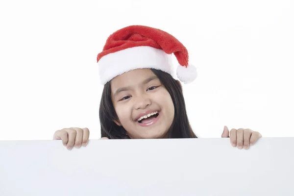 Портрет Щасливої Маленької Дівчинки Капелюсі Санта Позує Білою Панеллю Ізольовано — стокове фото