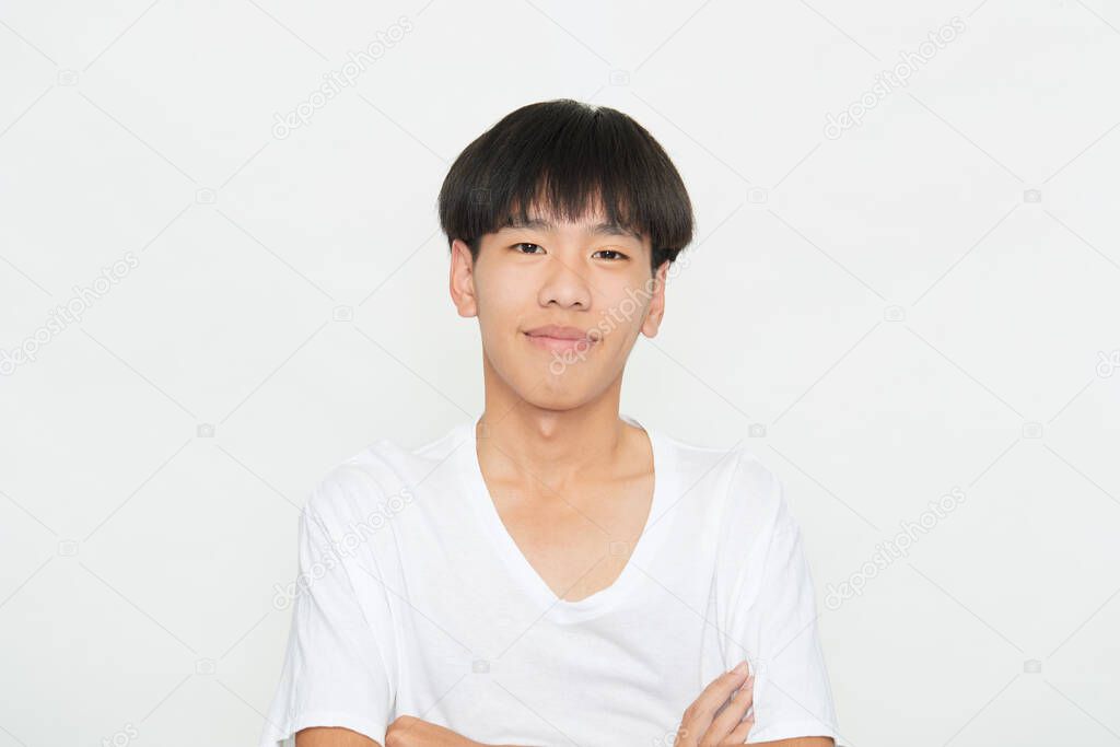 Horizontal shot of a handsome young guy with Brown eyes positive expression, being praised by someone, dressed casually, isolated white studio background