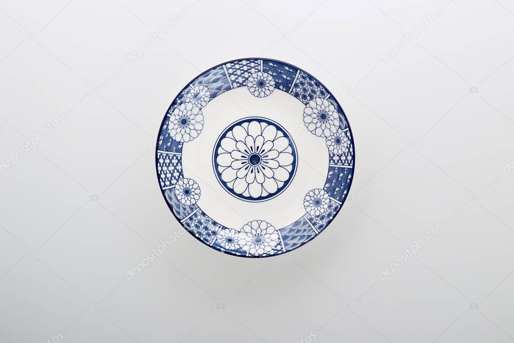 Ceramics decorative plates Blue and white pottery plate isolated on white background