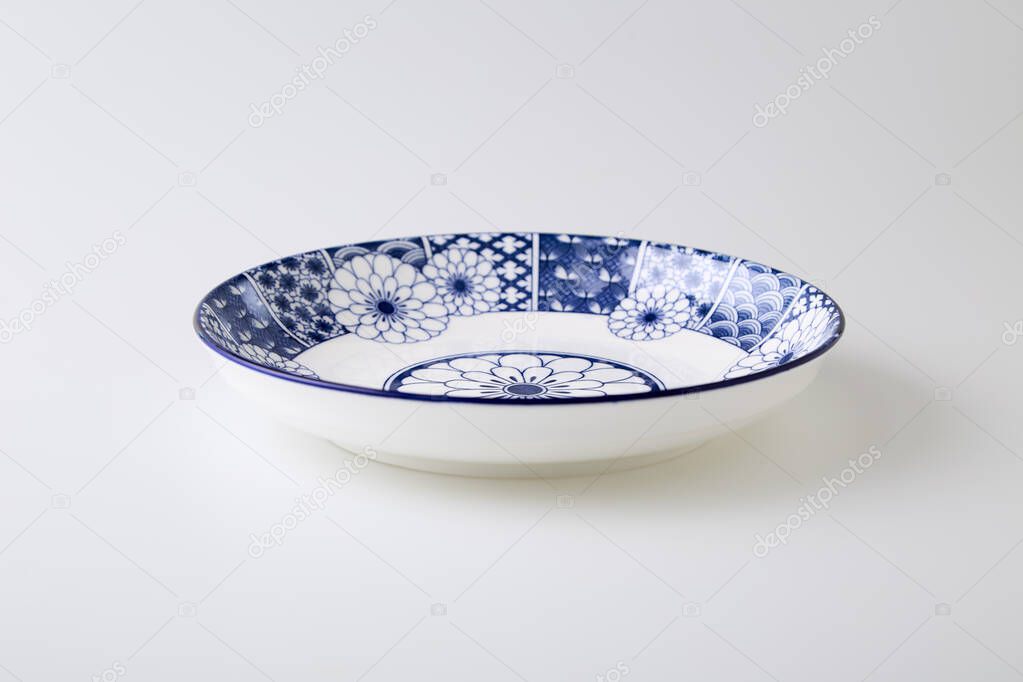 Ceramics decorative plates Blue and white pottery plate isolated on white background