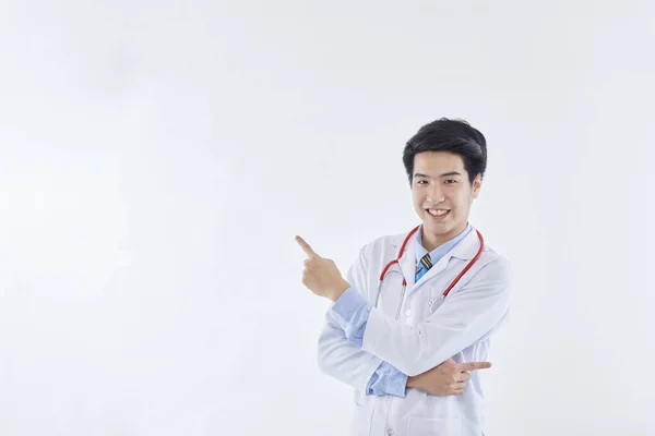 Asian Man Doctor Medical Gown Stethoscope Pointing Index Fingers Aside — Stock Photo, Image