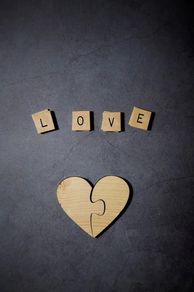 Love Text Word Wood Blocks Withe Wooden Heart Black Cement — стоковое фото