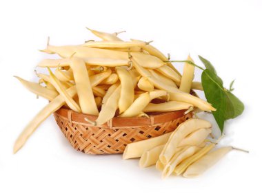 Soybean pods in wicker basket isolated on white background