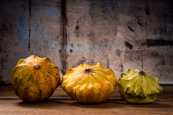 Decorative pumpkins on wooden table