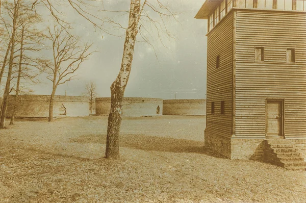 Aged sepia digital grunge distressed effect auschwitz concentrat — Stock Photo, Image