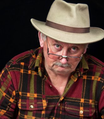  senior male with sad or grumpy face portrait