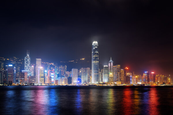 Night view of Hong Kong Island skyline across Victoria harbor