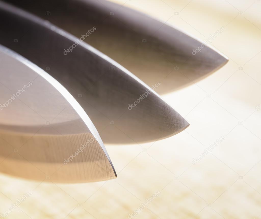 Knives on wooden board