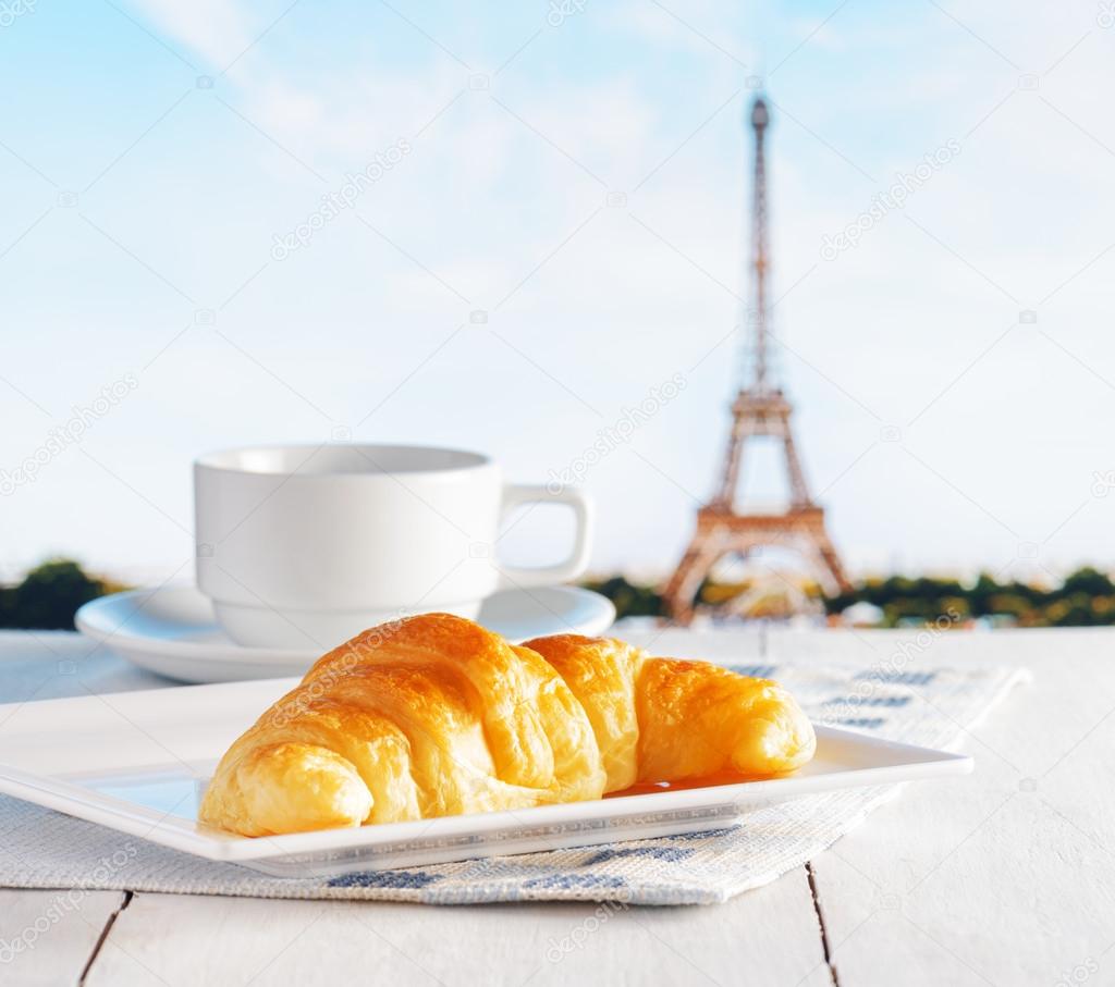 Cup of coffee and croissant in Paris