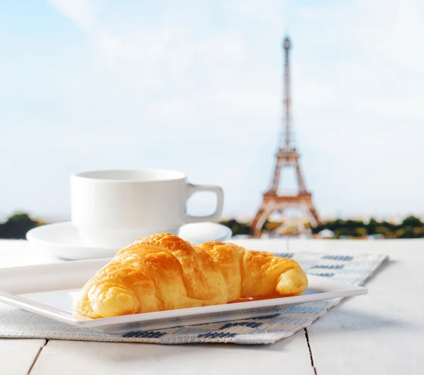 Cup of coffee and croissant in Paris