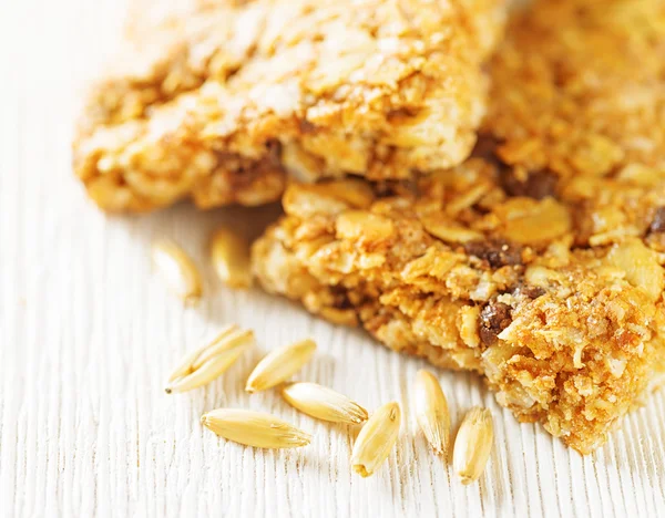 Oat granola bars on wooden table — Stock Photo, Image