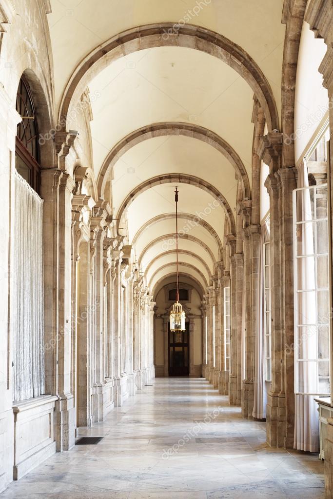 The passage with arches in the Royal Palace of Madrid in Spain