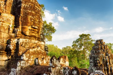 Ancient giant stone face of Bayon in Angkor Thom, Cambodia