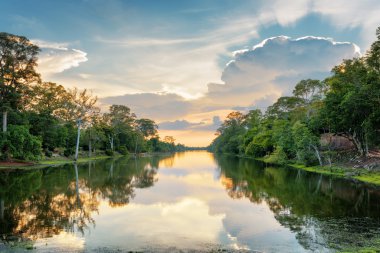 Beautiful sunset over moat surrounding Angkor Thom, Cambodia