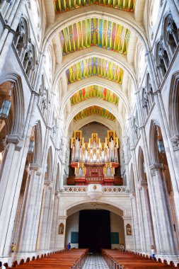 Arches and the pipe organ in the interior of the Cathedral
