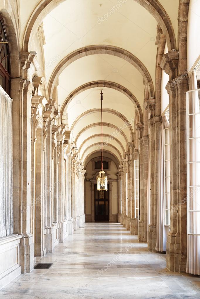The beautiful passage with arches in the Royal Palace of Madrid