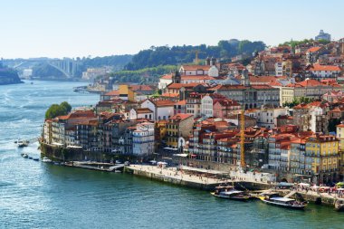 View of embankment of the Douro River and old houses in the hist