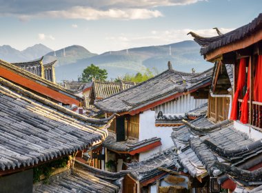 Traditional Chinese roofs of houses, the Old Town of Lijiang clipart