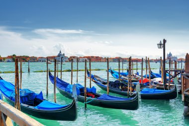 Gondolas parked beside the Riva degli Schiavoni, Venice, Italy