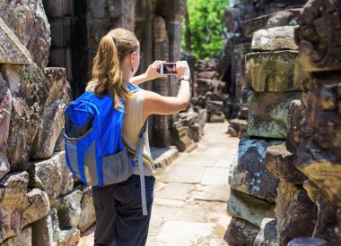 Tourist photographing in the temple. Angkor, Cambodia