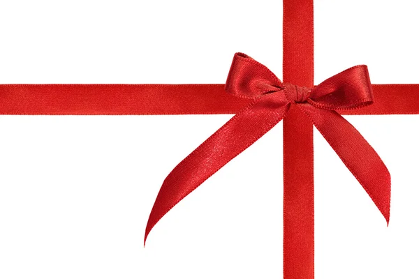 Блестящая красная атласная лента на белом фоне с копировальным пространством — стоковое фото