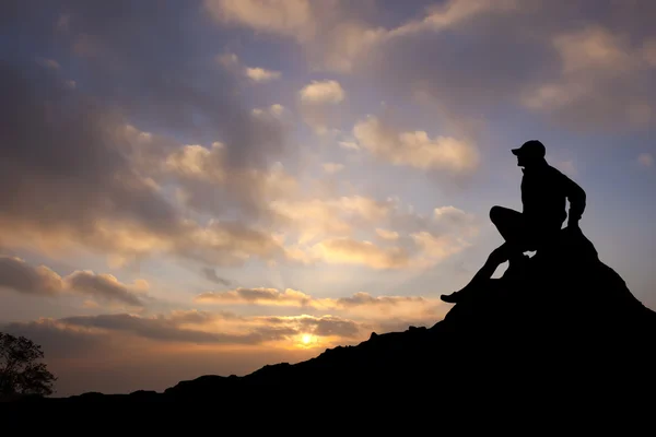 Silhouette of a man on mountain — Stock Photo, Image