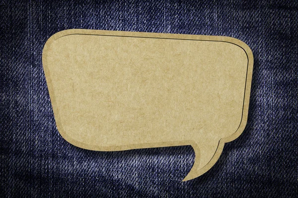 Speech Bubble on Wrinkled old blue jean texture — Stock Photo, Image